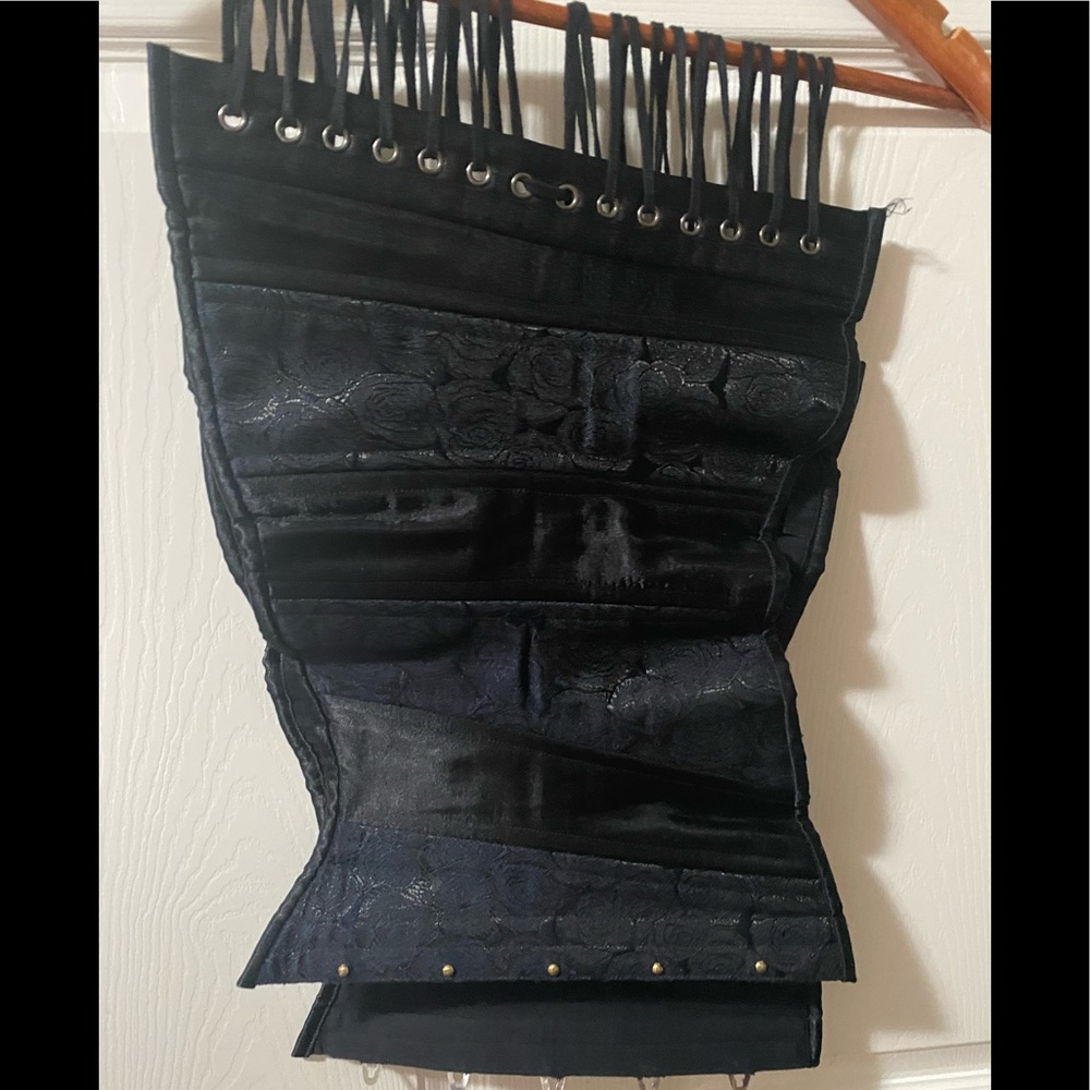 Heavy duty corset, black, with garter string hooks, eye hooks on the end.